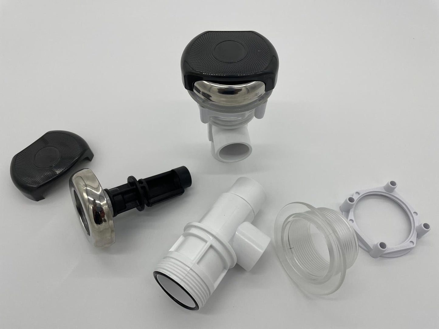 Balboa 2‑way water flow control valve assembly shown disassembled with cap, stem, valve body, and fittings, used for controlling spa waterfall or neck jet water flow.