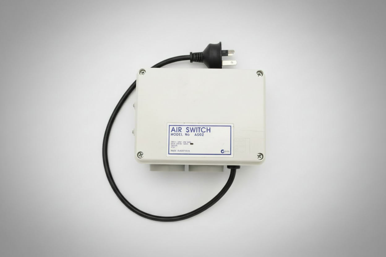 "Dual 10‑amp AS02 air switch unit with two outlets and air‑switch inlet, designed for spa equipment control."